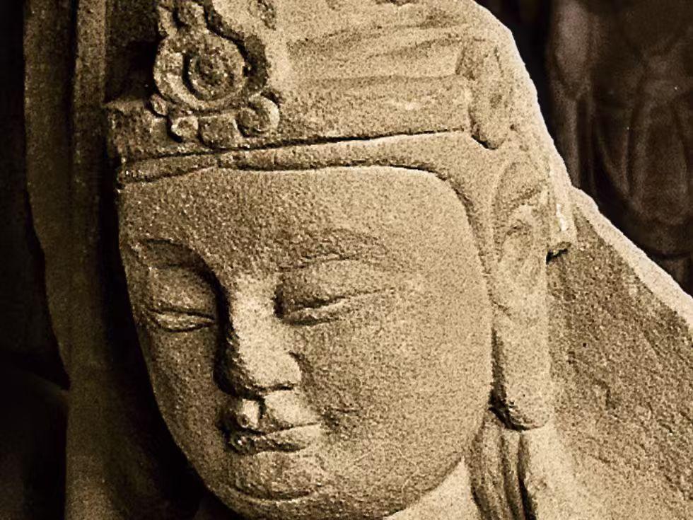 Real stone statue with weathered texture